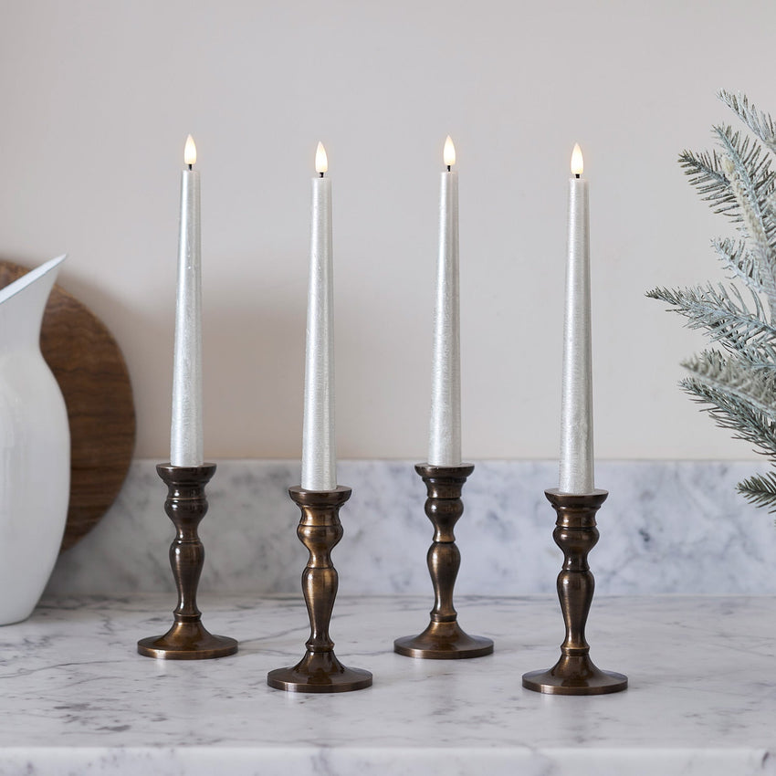 Champagne LED taper candles in kitchen