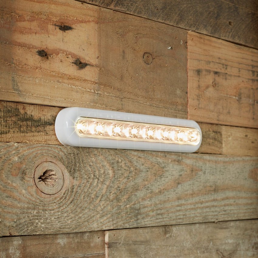 White cupboard light on wall