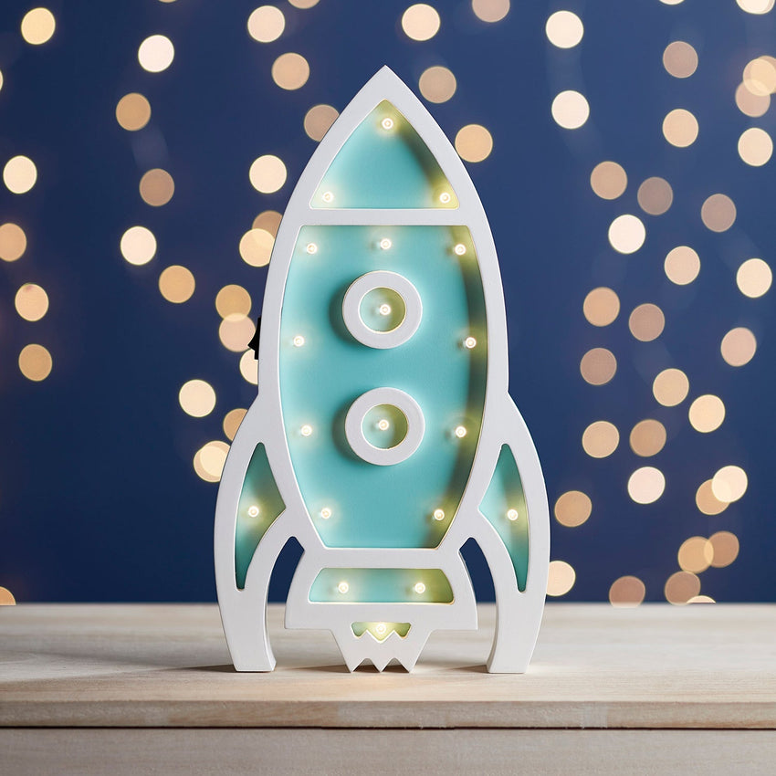 Children's rocket light on night sky background