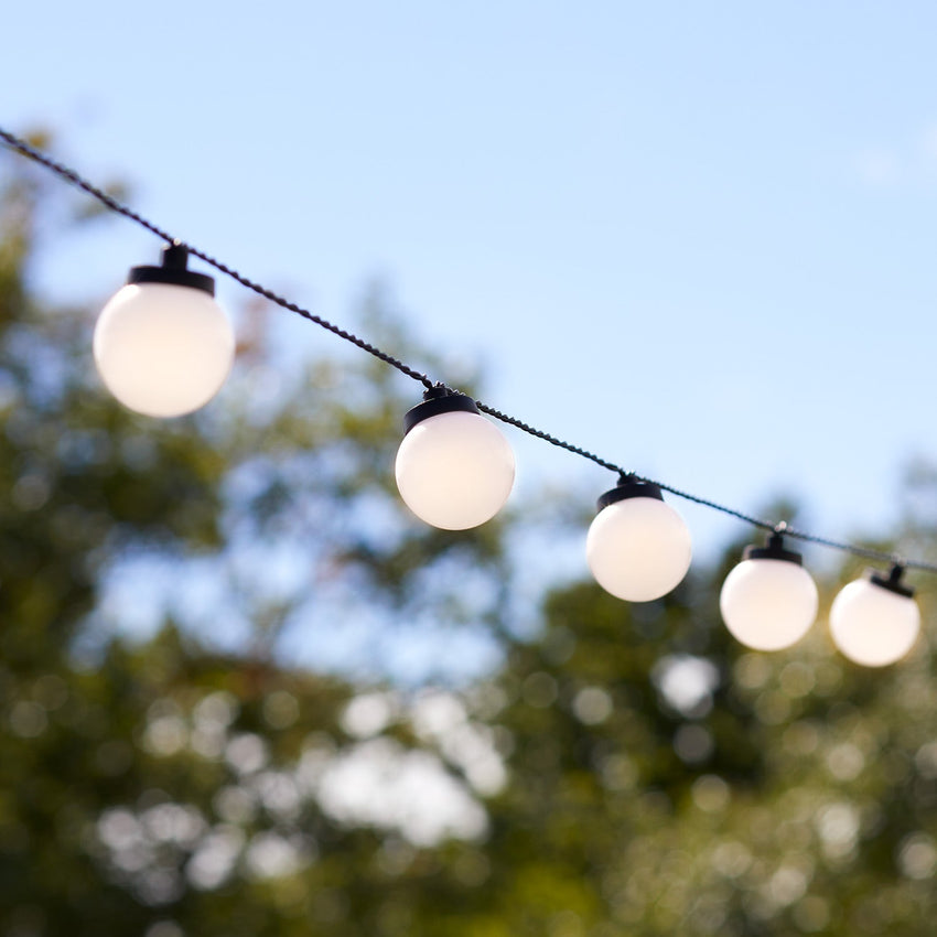 White festoon lights hung outdoors