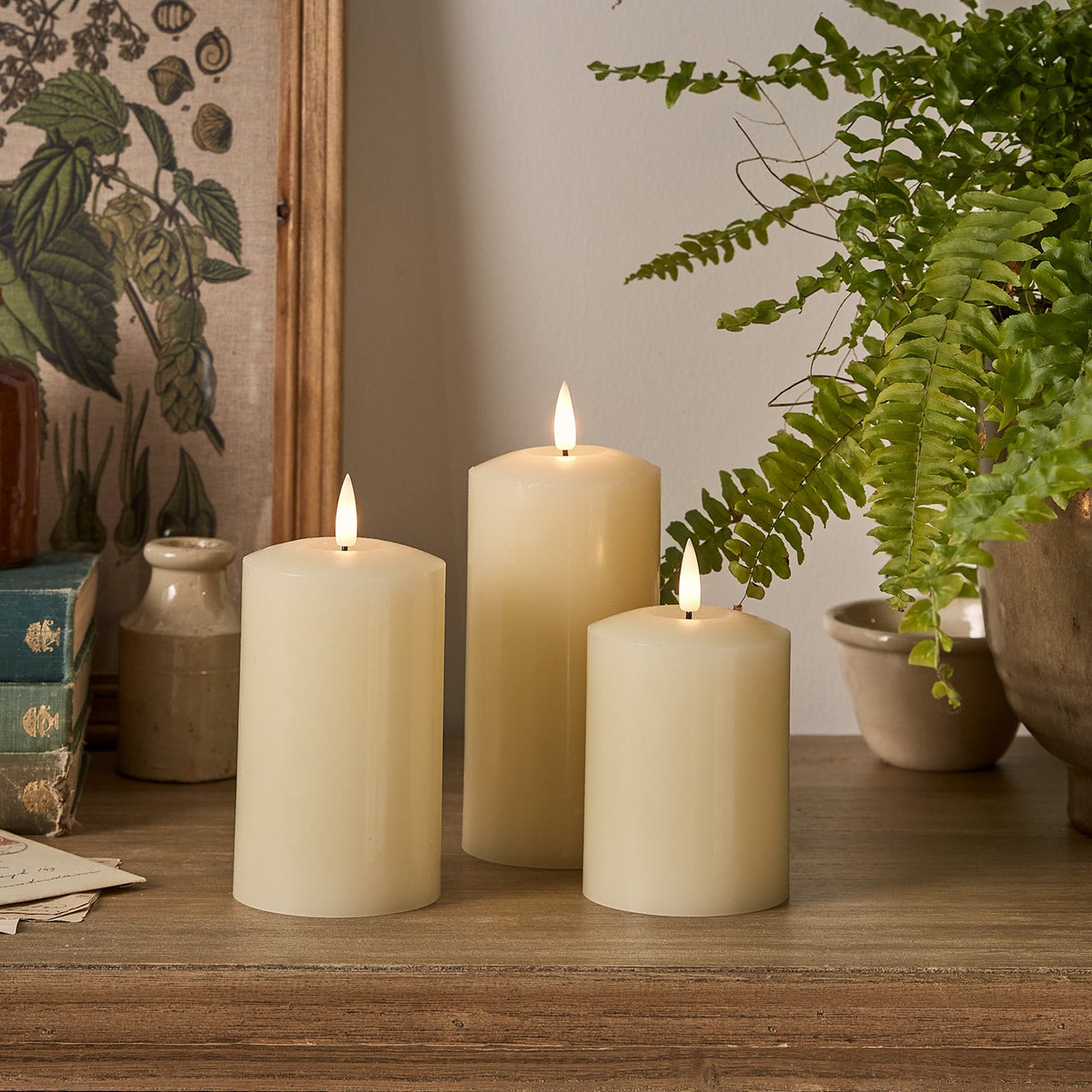 CA18013_TruGlow_-Ivory-LED-Pillar-Candle-Trio-Spring.jpg