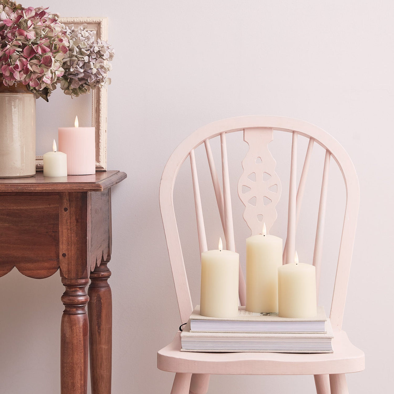 CA18013_truglow-led-pillar-candle-trio-white-chair.jpg