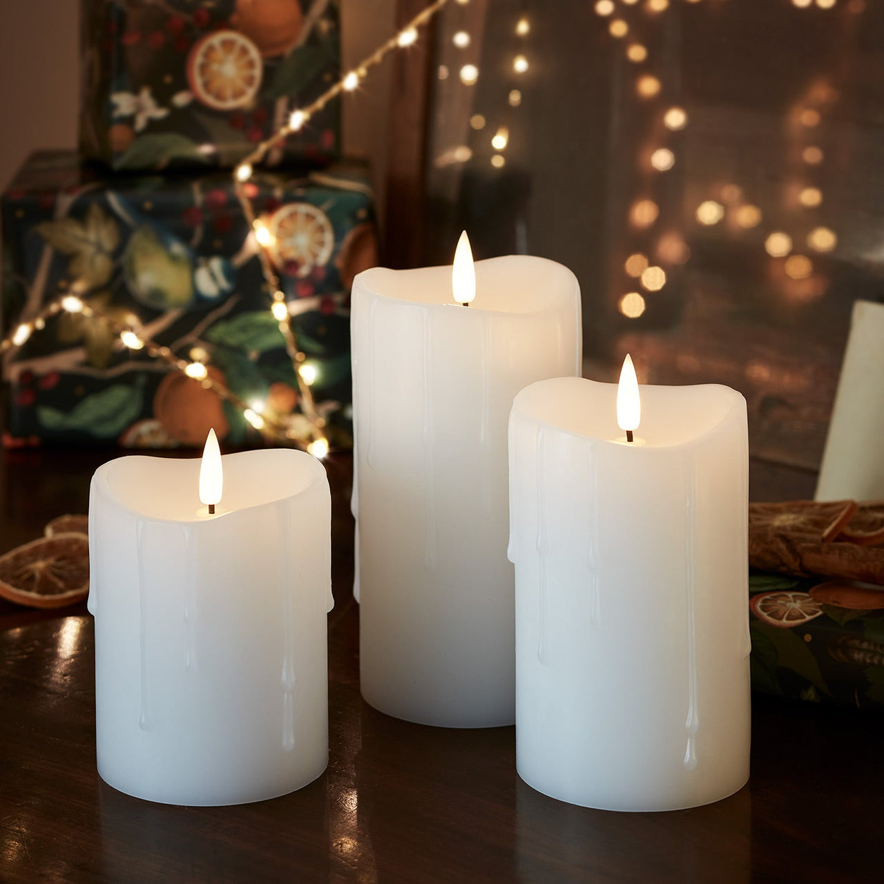 CA22002_TruGlow_-White-Dripping-Wax-LED-Pillar-Candle-Trio-Christmas_5a080a23-b383-4f3f-9460-b0a8236b645e.jpg