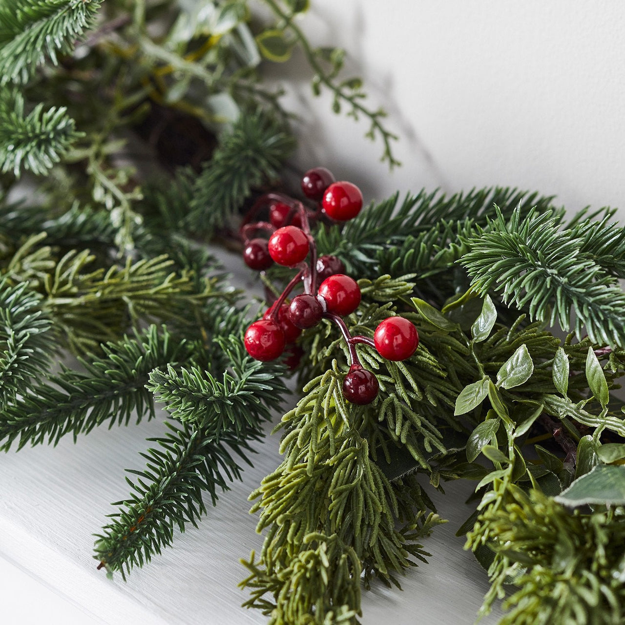 GA2003_Pine-Red-Berry-Christmas-Faux-Garland-Indoor-Close_010c13e8-62e9-406e-9f81-8fef5391ed1b.jpg