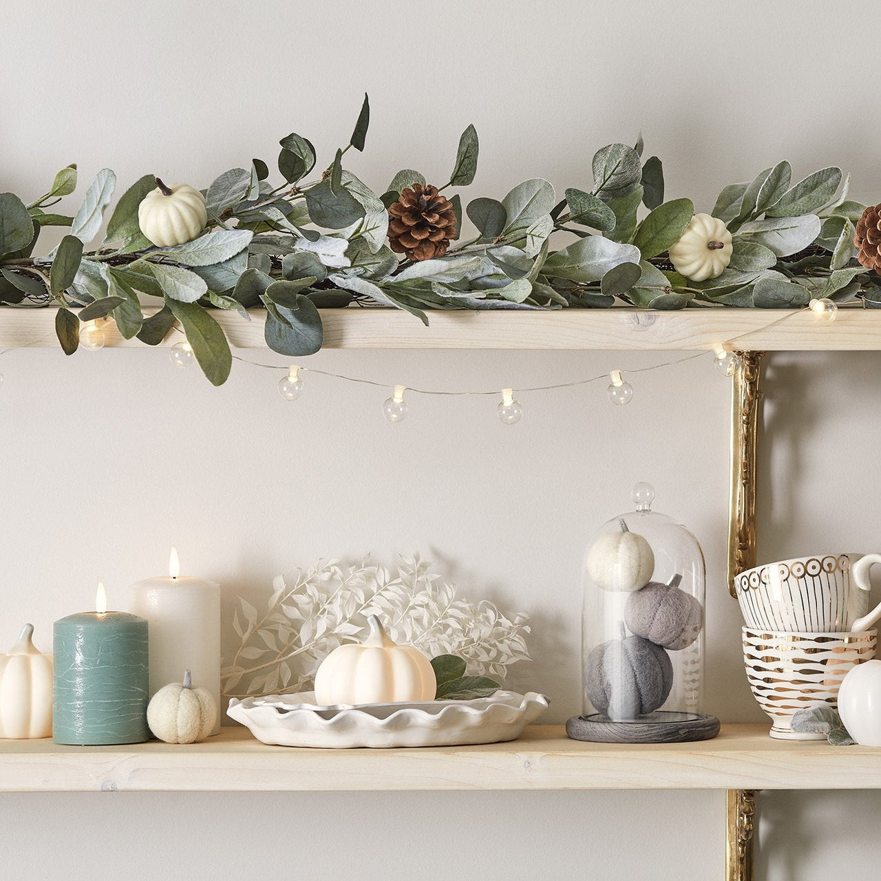 Green-Autumnal-Display-With-LED-Candles-And-Pumpkins_9dd68969-dea6-4fc2-a380-33399cd70fa0.jpg