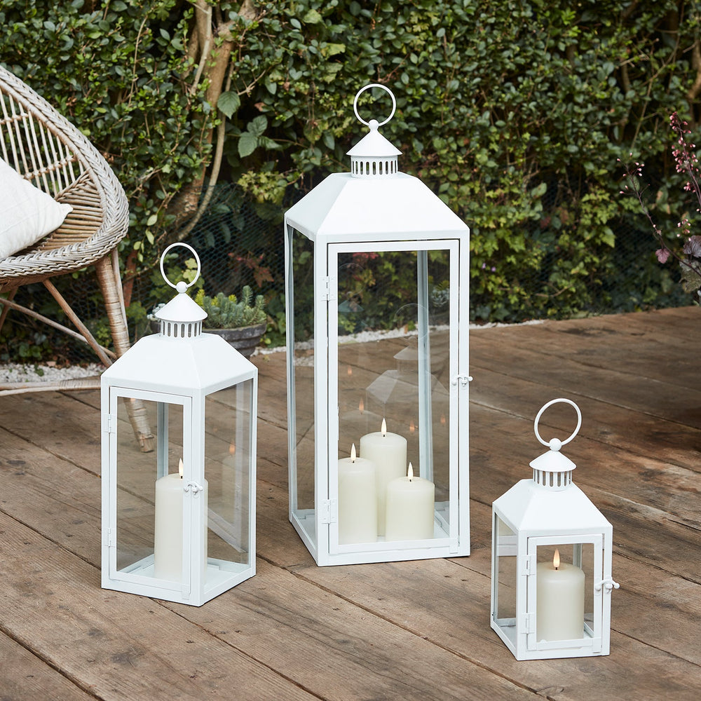LA20014_white-metal-lanterns-trio-truglows-outdoor-p2_cb170e0d-4b05-4bc6-9c3c-8d4de692c8eb.jpg