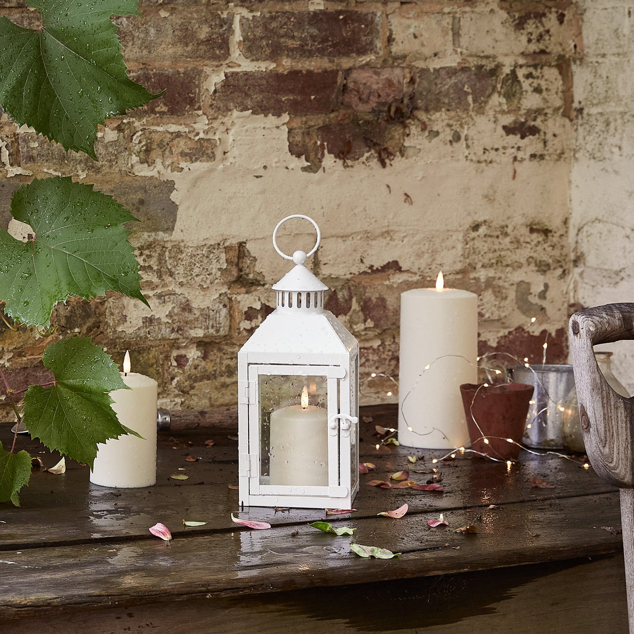 LA20016_perth-white-garden-lantern-with-truglow-candle-outside.jpg