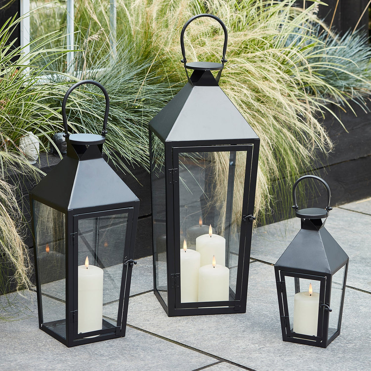 LA20021_black-metal-lantern-trio-outdoor-patio-p2.jpg