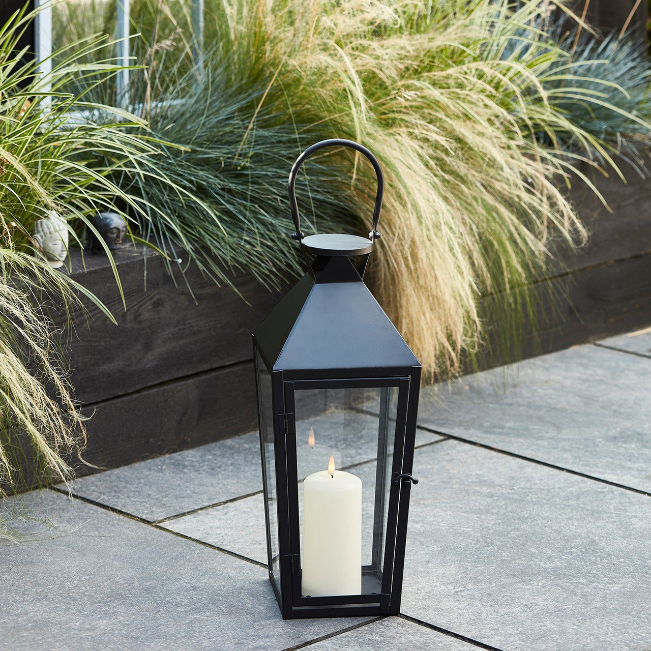 LA20021_medium-black-metal-lantern-truglow-outdoor-patio-p1_b78cac5b-8bf5-413a-b6e1-bf39fb34dc8d.jpg
