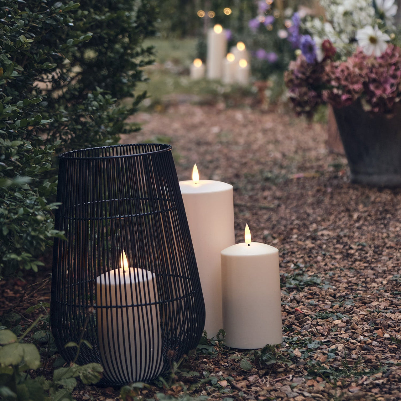 LA21011_large-melbourne-garden-lantern-with-troglow-candle-outside.jpg