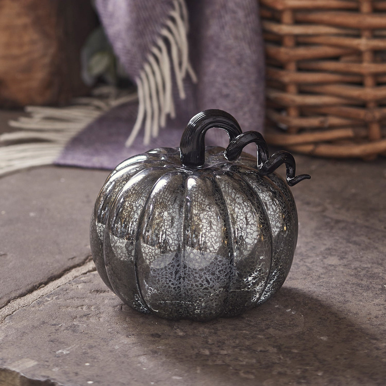 LL22063_Mercury-Black-Light-Up-Pumpkin-Decoration-Fireplace-Off.jpg