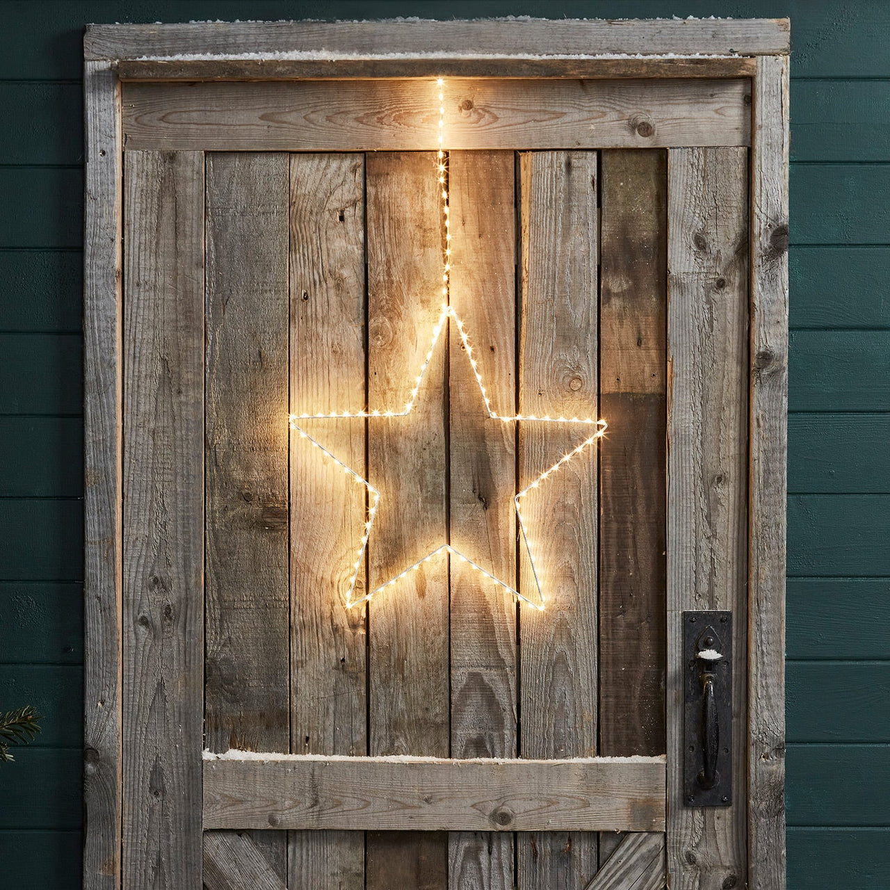 PL21047_Outdoor-Christmas-LED-Hanging-Star-Light-Cabin-Door-Illuminated.jpg